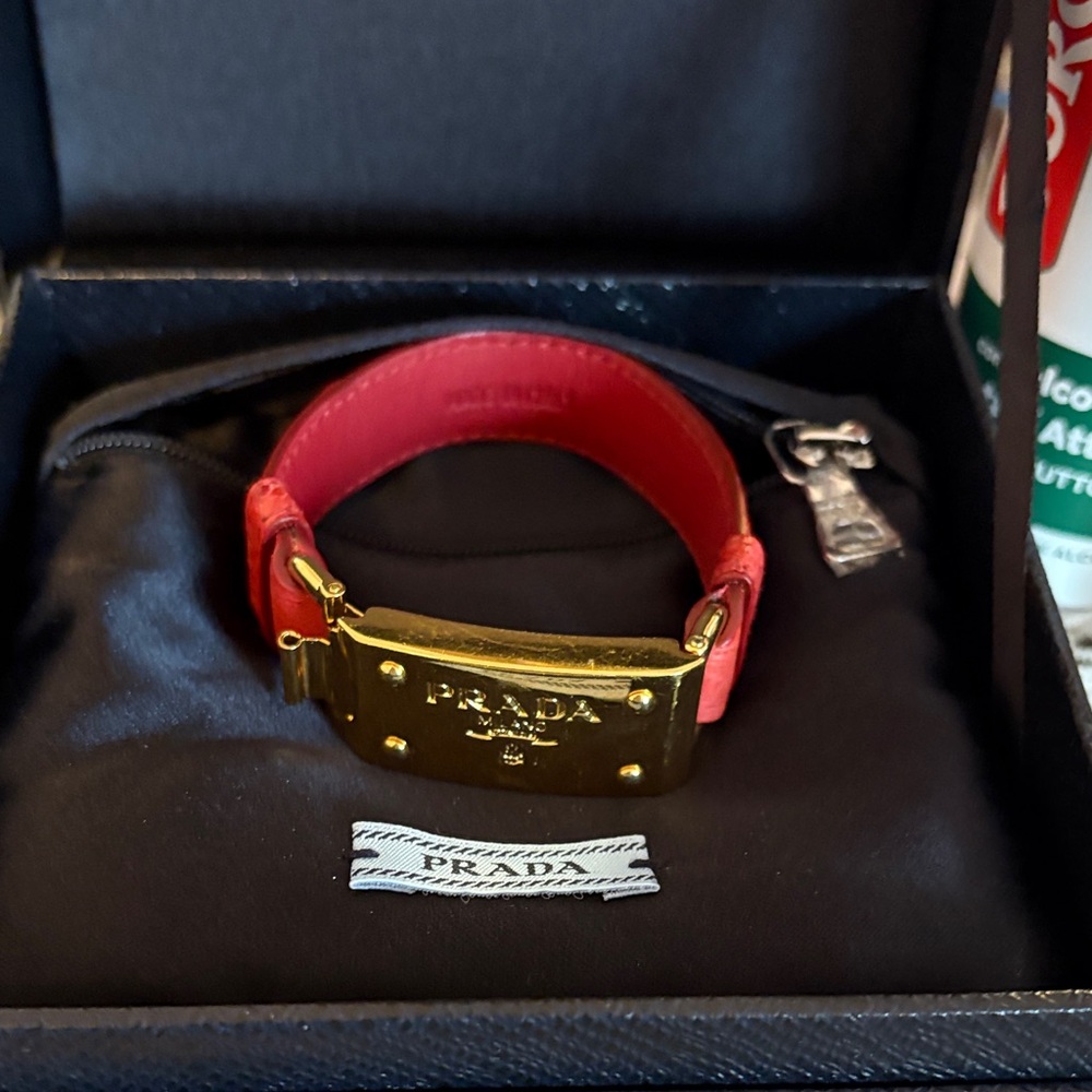 Prada Women's Red and Gold Watch